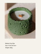 Green candle with a wooden wick on a light background