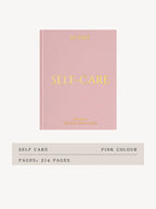 Pink self-care journal with gold text on a white background
