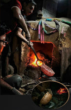 People working with hot metal in a forge, surrounded by tools and materials.