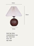 Table lamp with wooden base and pleated white shade, featuring dimensions and specifications.